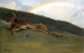 Arco iris sobre un ciervo caído luminismo Albert Bierstadt